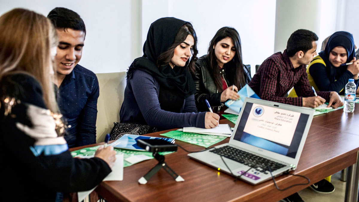 Student volunteers interview each other in a team building exercise