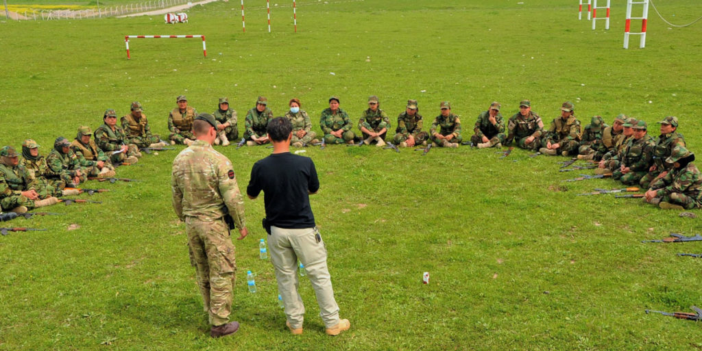 U.S. and Coalition troops train the female Peshmerga on battle formations and techniques as the sisterhood circles around and listens intently