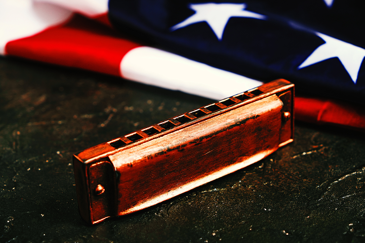Harmonica,On,The,Background,Of,The,Flag,Of,The,United Harmonica on the background of the flag of the United States of America
